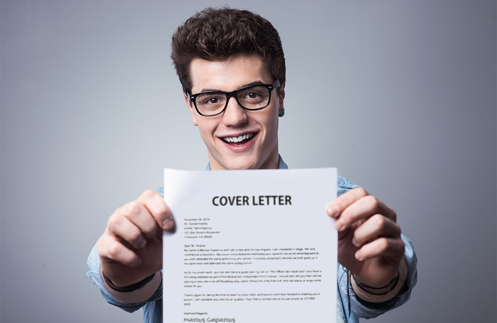 Guy holding resume cover letter