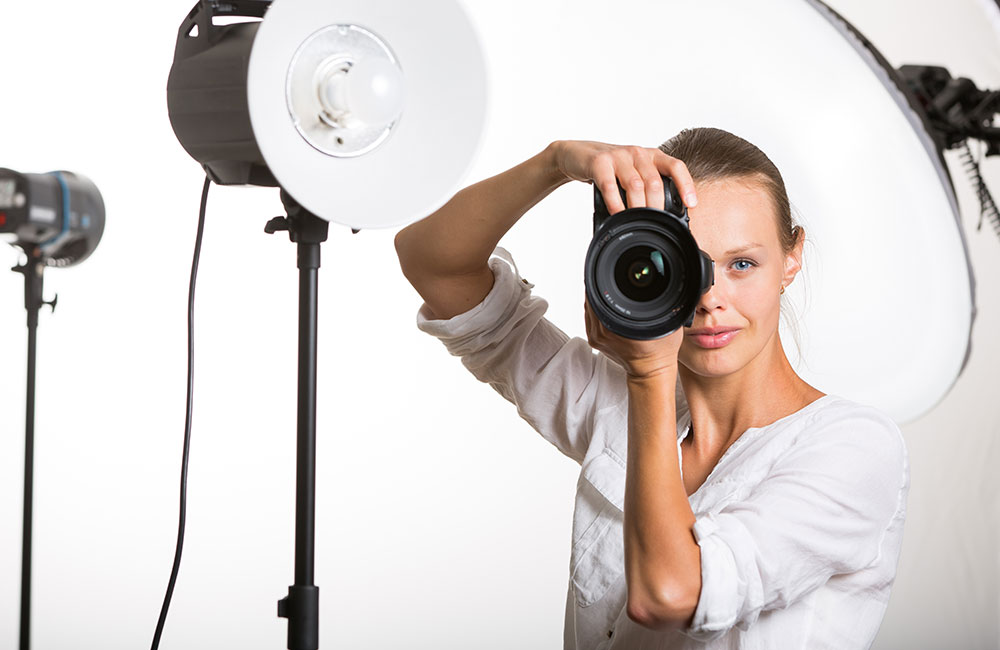 Woman photographer with camera