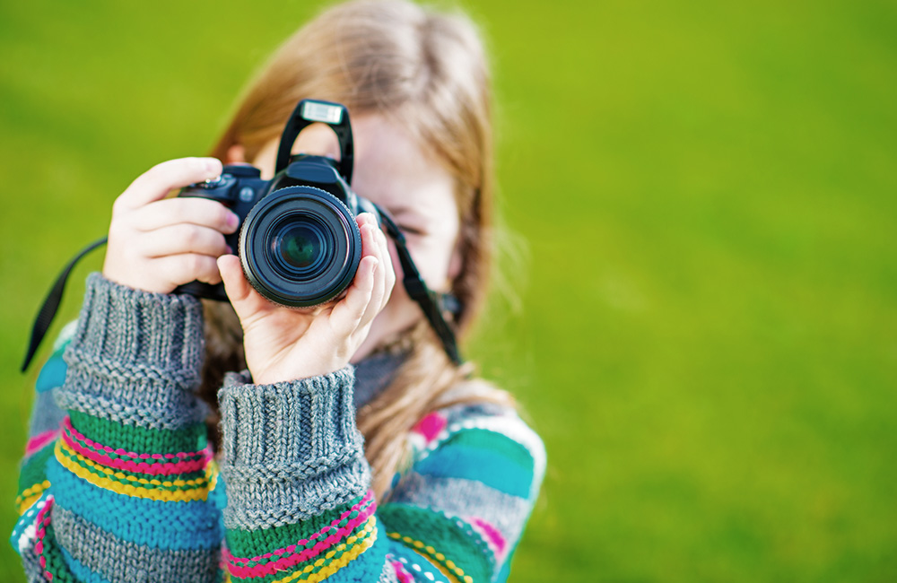 Girl photographer with camera